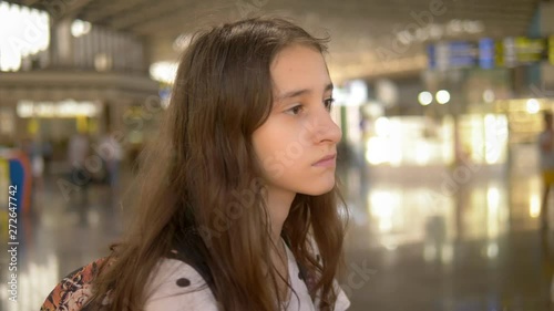 Wallpaper Mural portrait of a teenage girl with sadness standing at the airport. Blur background Torontodigital.ca