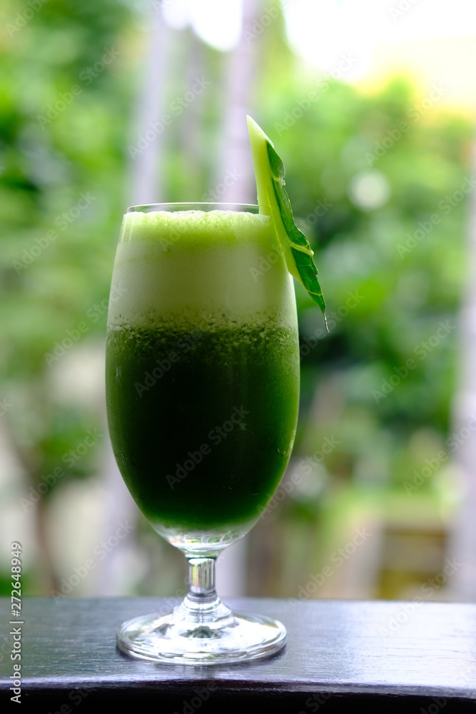 healthy kale smoothie on wood table healthy kale smoothie on wood table