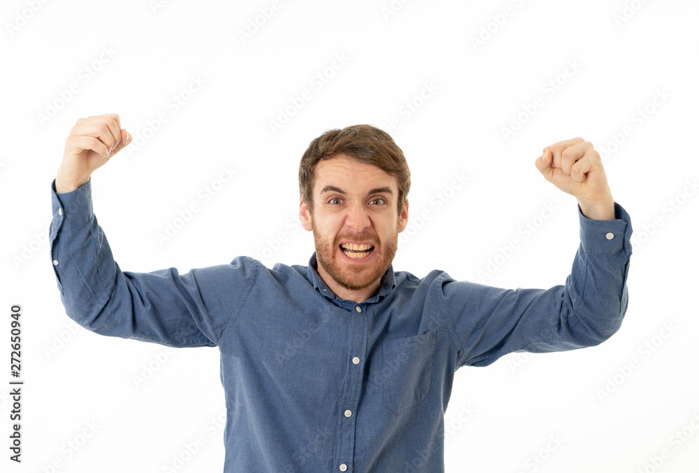 Portrait of surprised and happy man celebrating victory goal or winning lottery in human emotions Portrait of surprised and happy man celebrating victory goal or winning lottery in human emotions