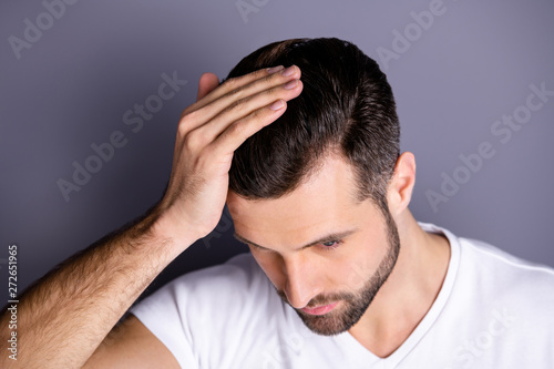 Close up top above high angle photo amazing he him his macho touch arm hand neat groomed head haircut not smiling look mirror bath empty space wear casual white t-shirt isolated grey background