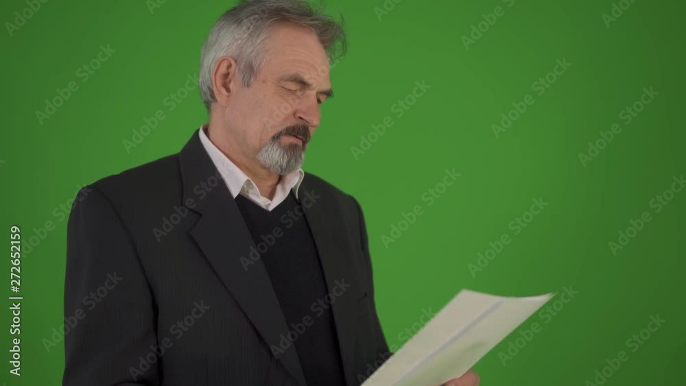 Elderly man having problems with documents, confused aged man looking through papers, checking unpaid bills. close up shot Elderly man having problems with documents, confused aged man looking through papers, checking unpaid bills. close up shot