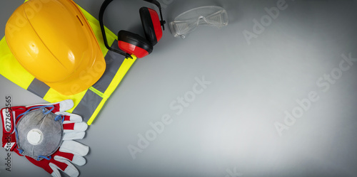 work safety items of construction industry on gray background with copy space
