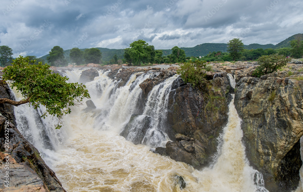 Hogenakkal Falls - Waterfall is in South India on the Kaveri river in the Dharmapuri district of the Indian state of Tamil Nadu. It is located 180 km from Bangalore and 46 km from Dharmapuri. Hogenakkal Falls - Waterfall is in South India on the Kaveri river in the Dharmapuri district of the Indian state of Tamil Nadu. It is located 180 km from Bangalore and 46 km from Dharmapuri.
