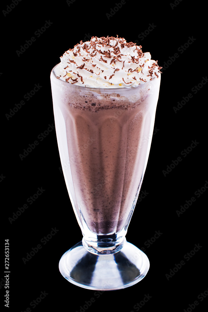 Freshly brewed cappuccino with foam in a glass cup on black isolated background Freshly brewed cappuccino with foam in a glass cup on black isolated background