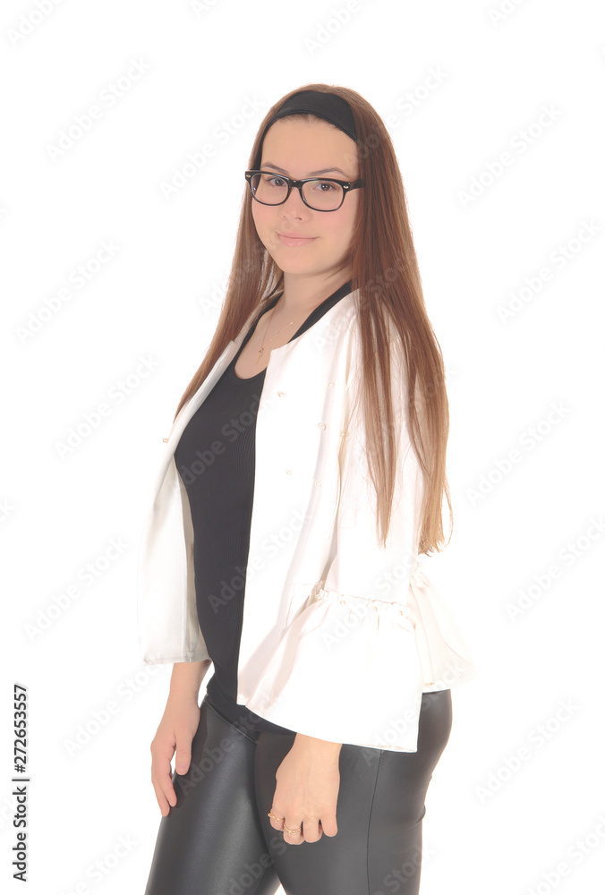 Lovely young teenage girl standing in profile with glasses Lovely young teenage girl standing in profile with glasses