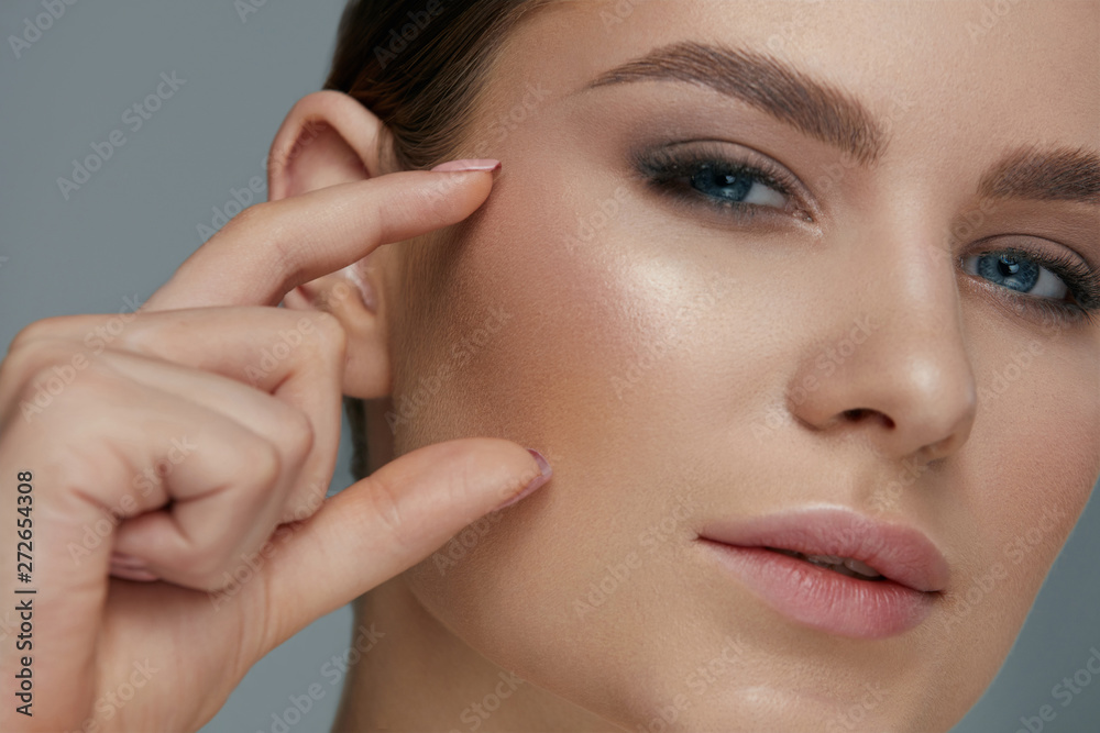 Beauty face makeup. Woman with beautiful eyes and eyebrows Beauty face makeup. Woman with beautiful eyes and eyebrows