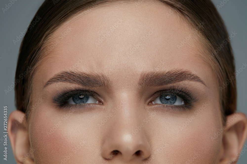 Beauty makeup. Woman face with eyes and eyebrows make-up Beauty makeup. Woman face with eyes and eyebrows make-up
