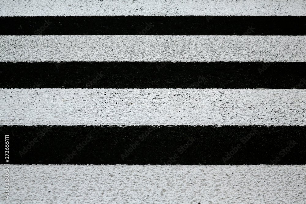 Fototapeta premium zebra crosswalk on a asphalt road background