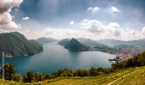 Panoramic view of the scenic Lugano Lake in Switzerland by day as seen from Mont Bre photo