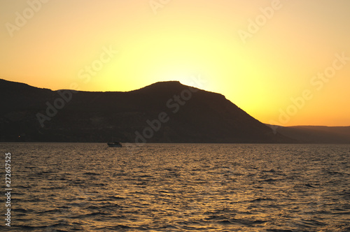 Golden sunset over the mountines and sea. Cyprus
