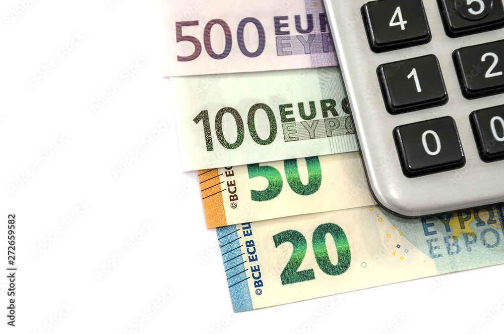 euro banknotes and calculator on white background euro banknotes and calculator on white background