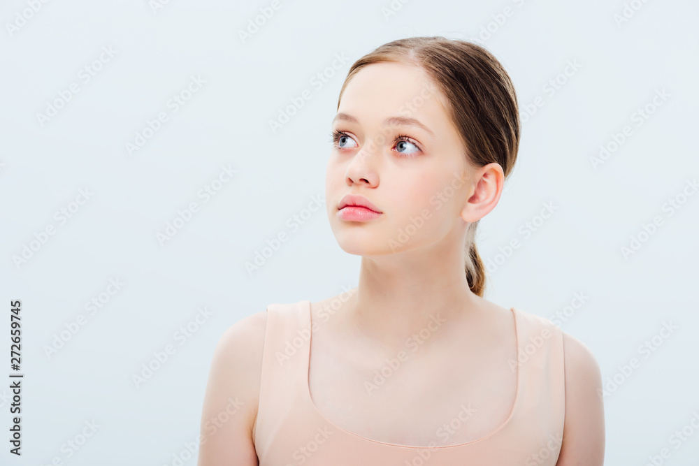 dreamy teenage girl looking away isolated on grey dreamy teenage girl looking away isolated on grey