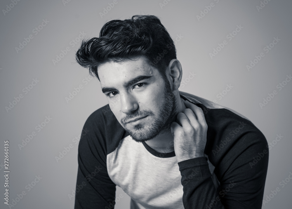 Fashion portrait of Attractive young manly man model posing happy and sexy for the camera Fashion portrait of Attractive young manly man model posing happy and sexy for the camera