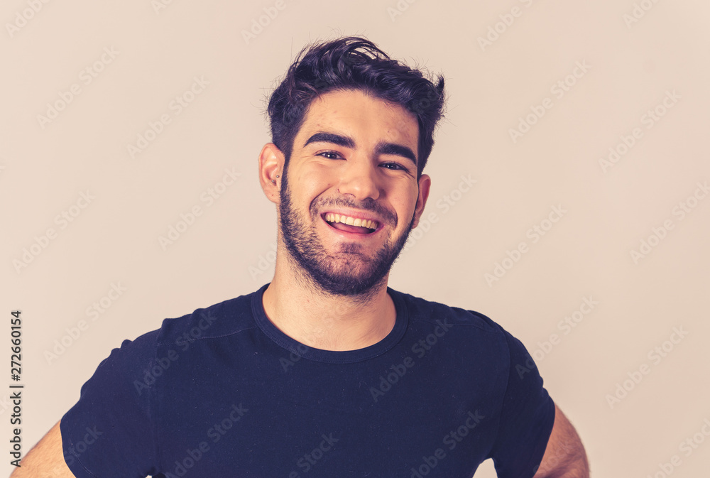 Obraz premium Human expressions and emotions. Joyful young attractive man smiling with happy face