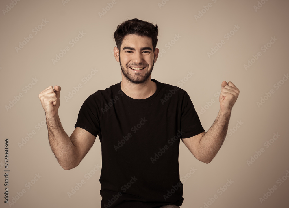 Cheerful surprised and happy man celebrating victory and wining lottery Cheerful surprised and happy man celebrating victory and wining lottery