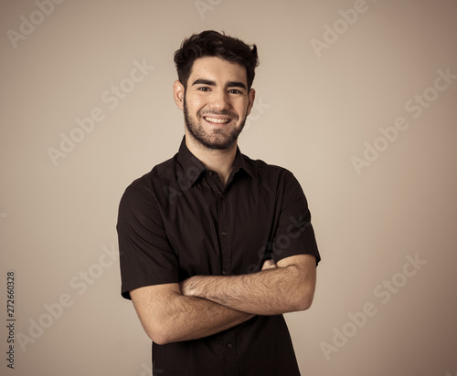 Fashion portrait of Attractive young manly man model posing happy and sexy for the camera