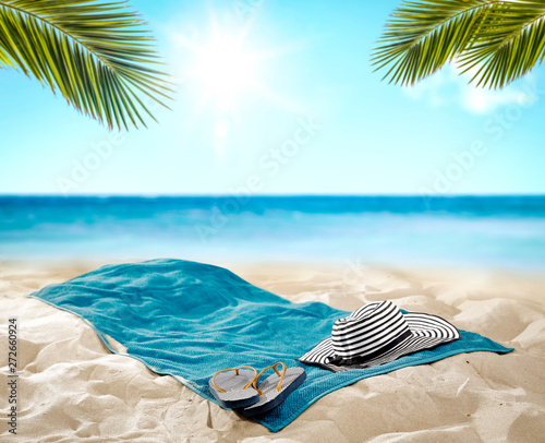 Fototapeta Naklejka Na Ścianę i Meble -  Summer towel on beach and free space for your decoration. Summer time 