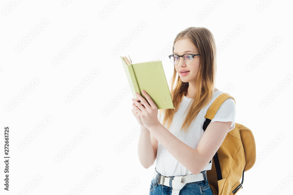 excited schoolgirl with backpack reading book isolated on white excited schoolgirl with backpack reading book isolated on white