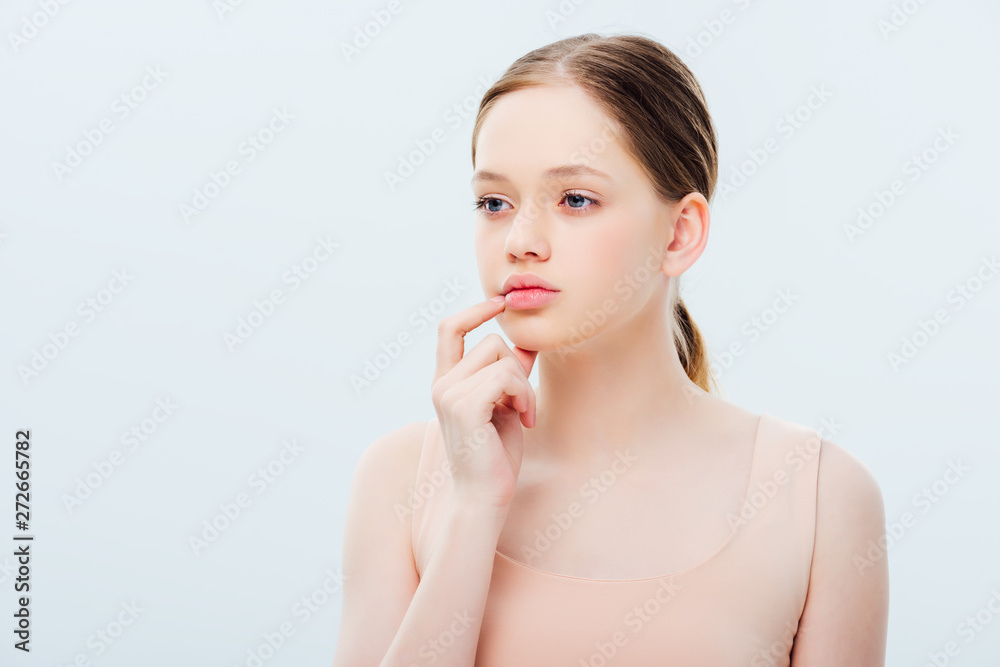 pensive teenage girl looking away isolated on grey pensive teenage girl looking away isolated on grey