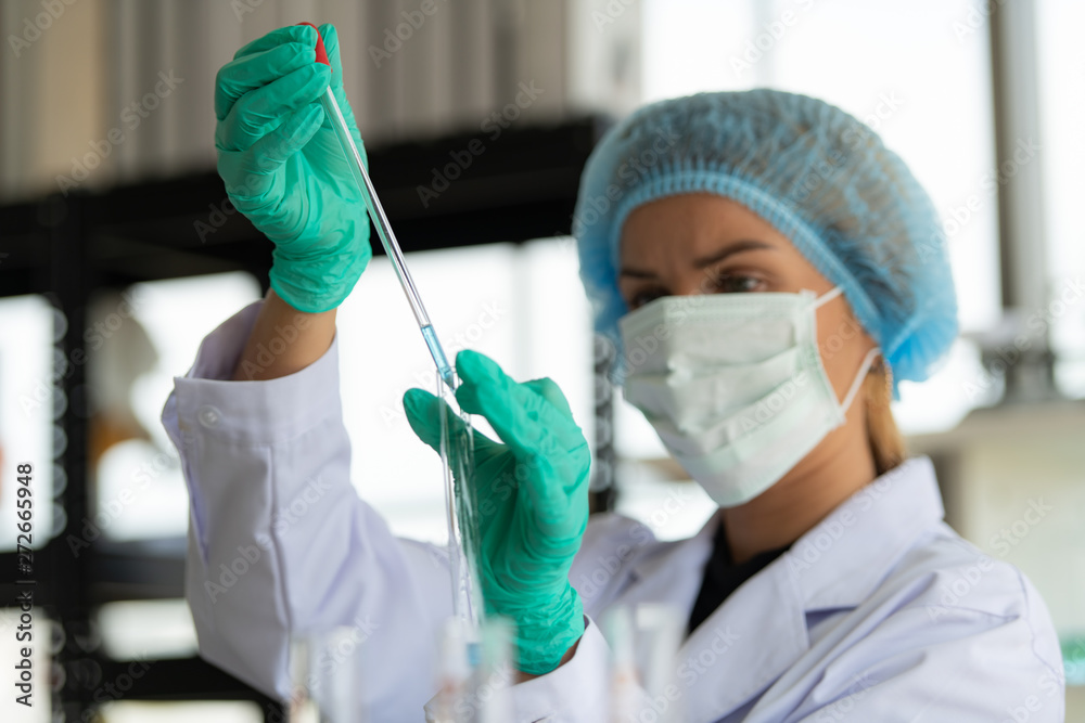 Women in the chemistry laboratory in the science laboratory,nalyzing and experimenting chemical formulas Women in the chemistry laboratory in the science laboratory,nalyzing and experimenting chemical formulas