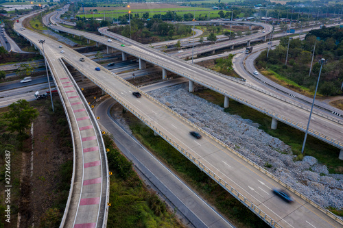 aerial view interchange freeway overpasses and motorway ring road connecting in the city transportation logistics concept in Thailand