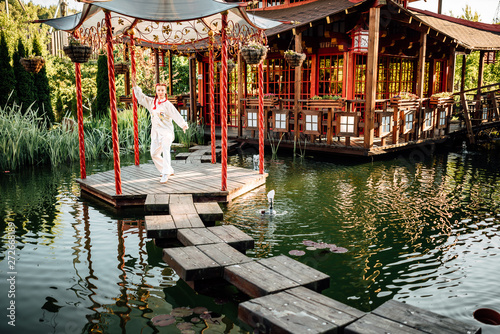 women practicing yoga and tai chi outdoors..