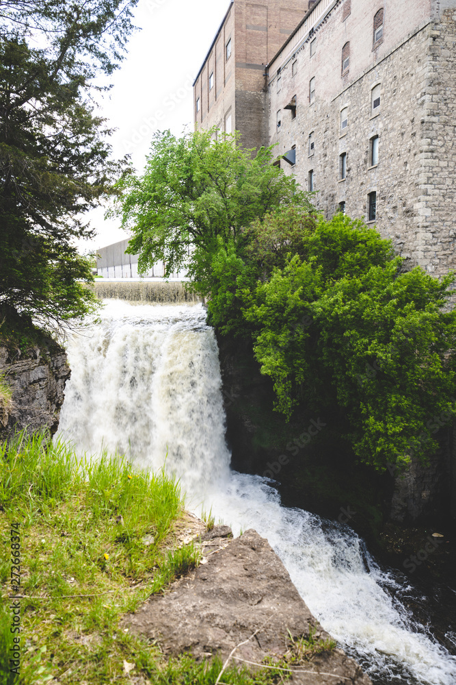 Vermillion Falls, an urban waterfall next to an old factory located in Hastings, Minnesota