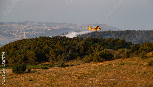 Putting out a fire with a plane