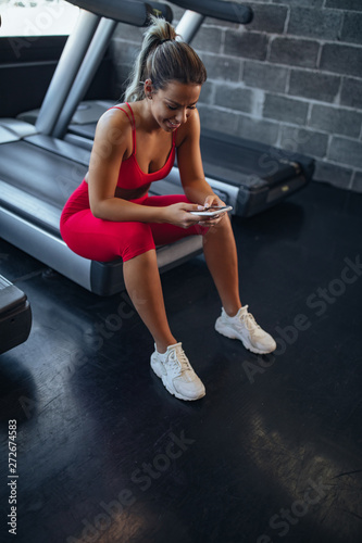 Beautiful young woman relaxing after doing exercise