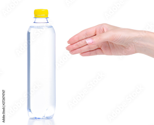 Bottle of water in hand on white background isolation