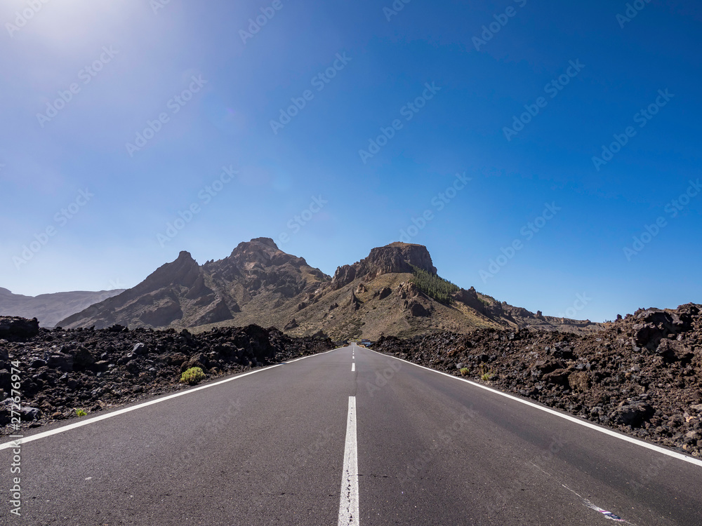An empty road on the expanse natural landscape in Tenerife Canary Islands Spain