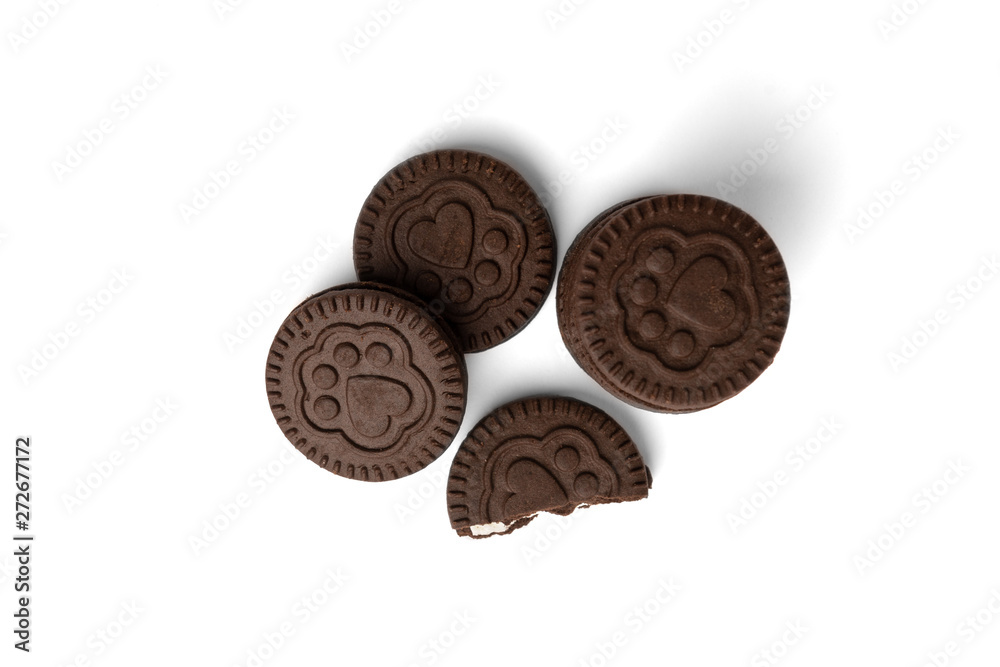 Chocolate cookies with milk filling isolated on white background. Chocolate cookies with milk filling isolated on white background.