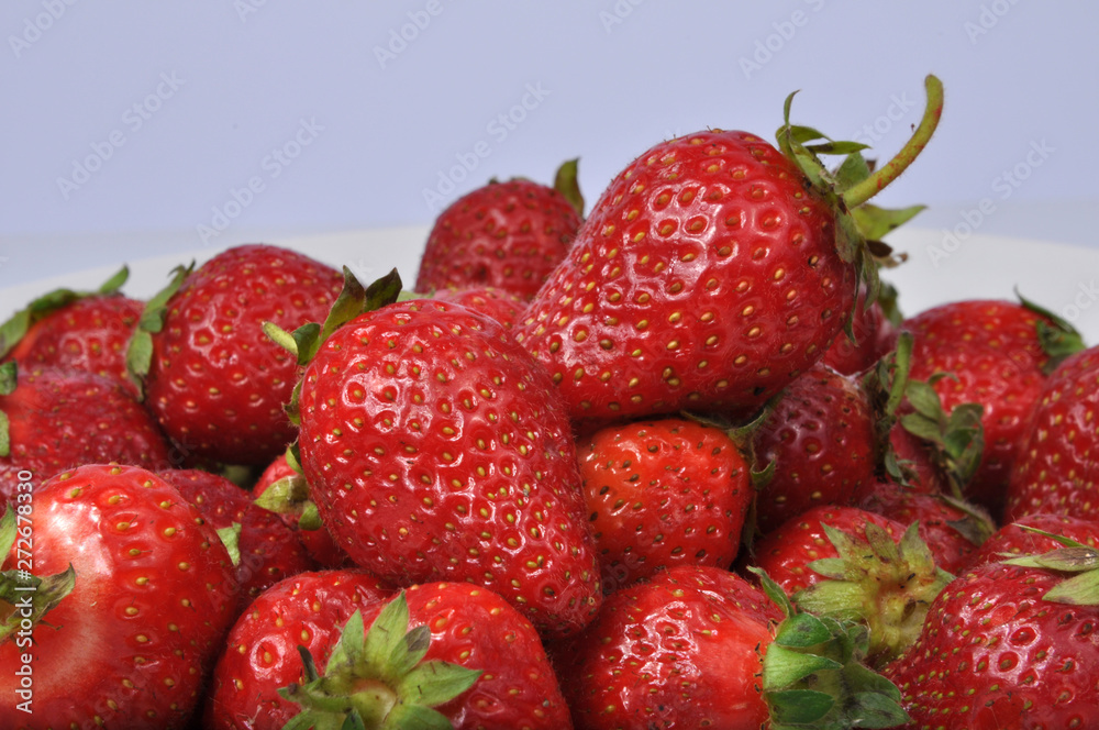 Red fresh strawberry isolated on the white Red fresh strawberry isolated on the white