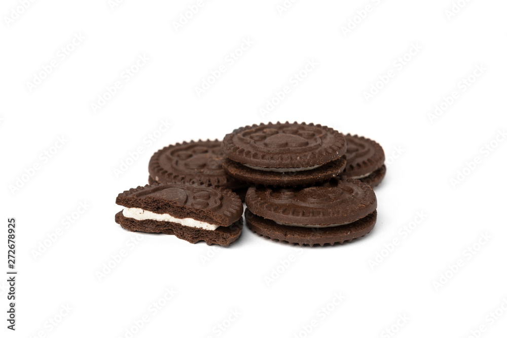 Chocolate cookies with milk filling isolated on white background. Chocolate cookies with milk filling isolated on white background.