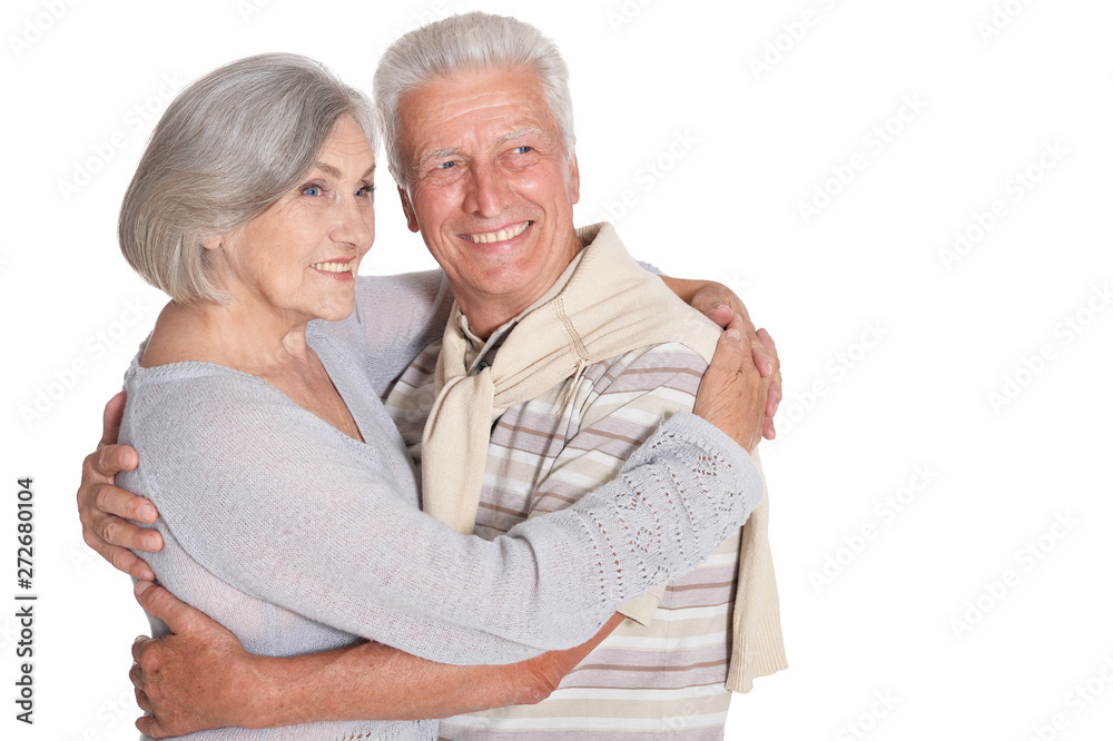 Portrait of happy senior couple hugging on white background Portrait of happy senior couple hugging on white background