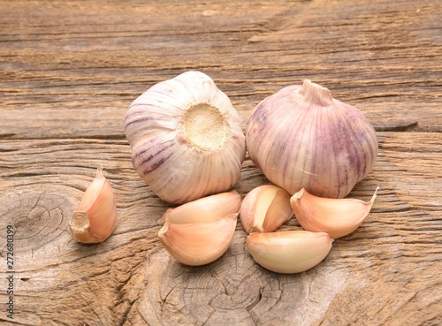Fresh garlic on wooden background. Still life with raw vegetable