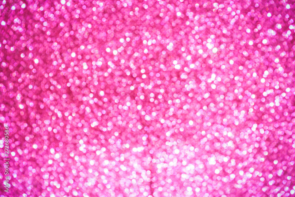 pink Sparkling Lights Festive background with texture. Abstract Christmas twinkled bright bokeh defocused and Falling stars. Winter Card or invitation