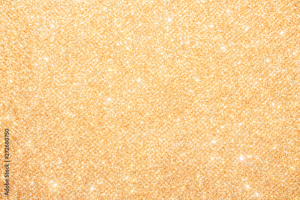 gold Sparkling Lights Festive background with texture. Abstract Christmas twinkled bright bokeh defocused and Falling stars. Winter Card or invitation