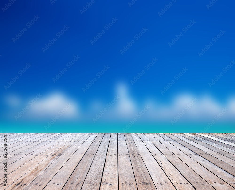  Wood floor on blurred sand beach background. beach and tropical sea