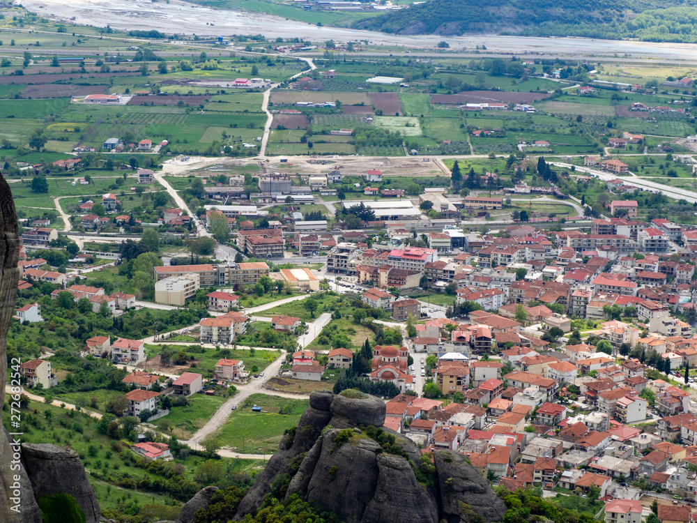 View of the red roofs of the Kalambaka town from the Meteora rocks, Greece.