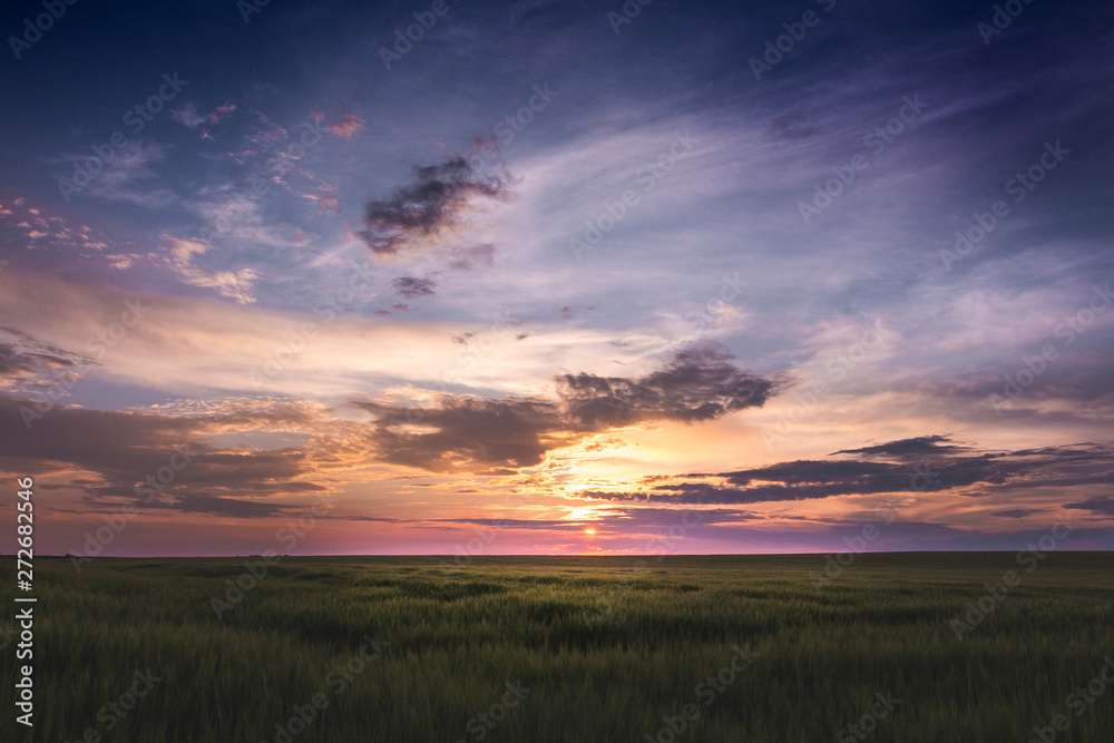 Scenic sunset with dark sky and dramatic clouds_ Scenic sunset with dark sky and dramatic clouds_