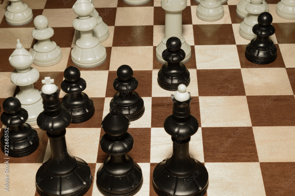 Wooden chess board and white pawns like a sport backdrop Wooden chess board and white pawns like a sport backdrop