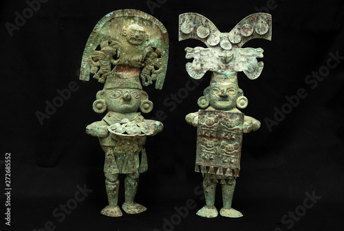 Pre-columbian copper men figure from Lambayeque ancient Peruvian culture. Pre inca handcrafted metallic piece made by ancient civilization.