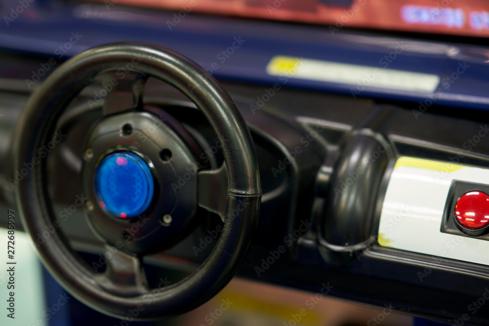 Obraz premium car steering of console of racer game machine in game arcade