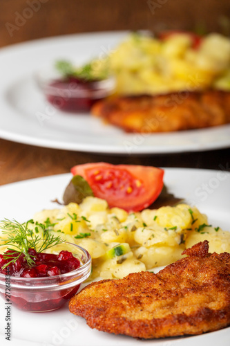 Photography wiener schnitzel with potato salad