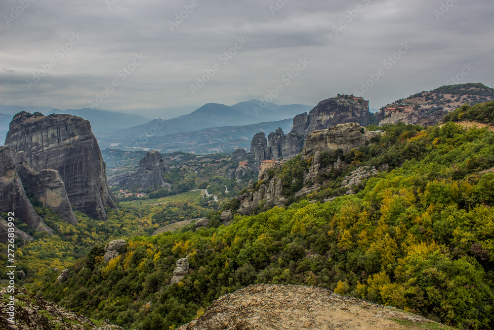 picturesque scenic landscape of famous Greek world heritage destination site for tourists and pilgrimage to christian monasteries, dramatic cloudy autumn season weather time
