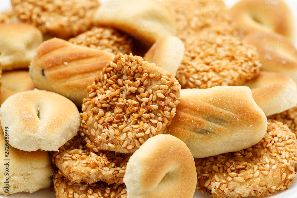 Traditional oriental cookies with sesame and dates, macro shot Traditional oriental cookies with sesame and dates, macro shot