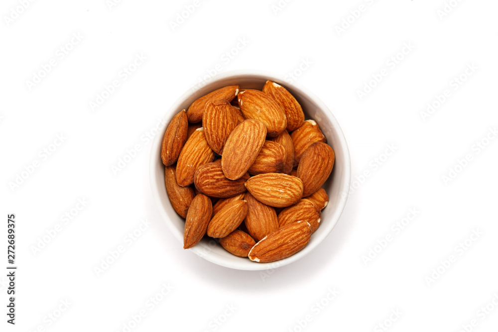 Almond in ceramic bowl on a white background