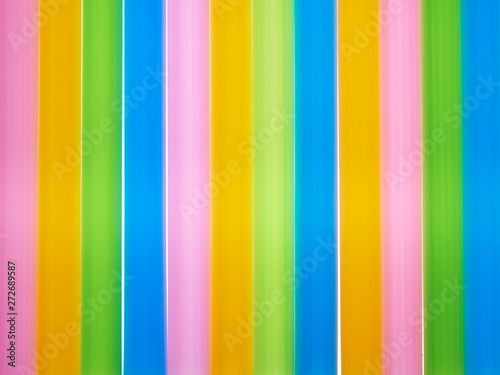 Colorful illuminated background with vertical drinking tubules. 