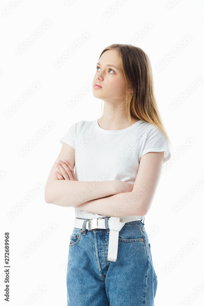 Fototapeta premium upset and offended teenage girl with crossed arms looking away isolated on white
